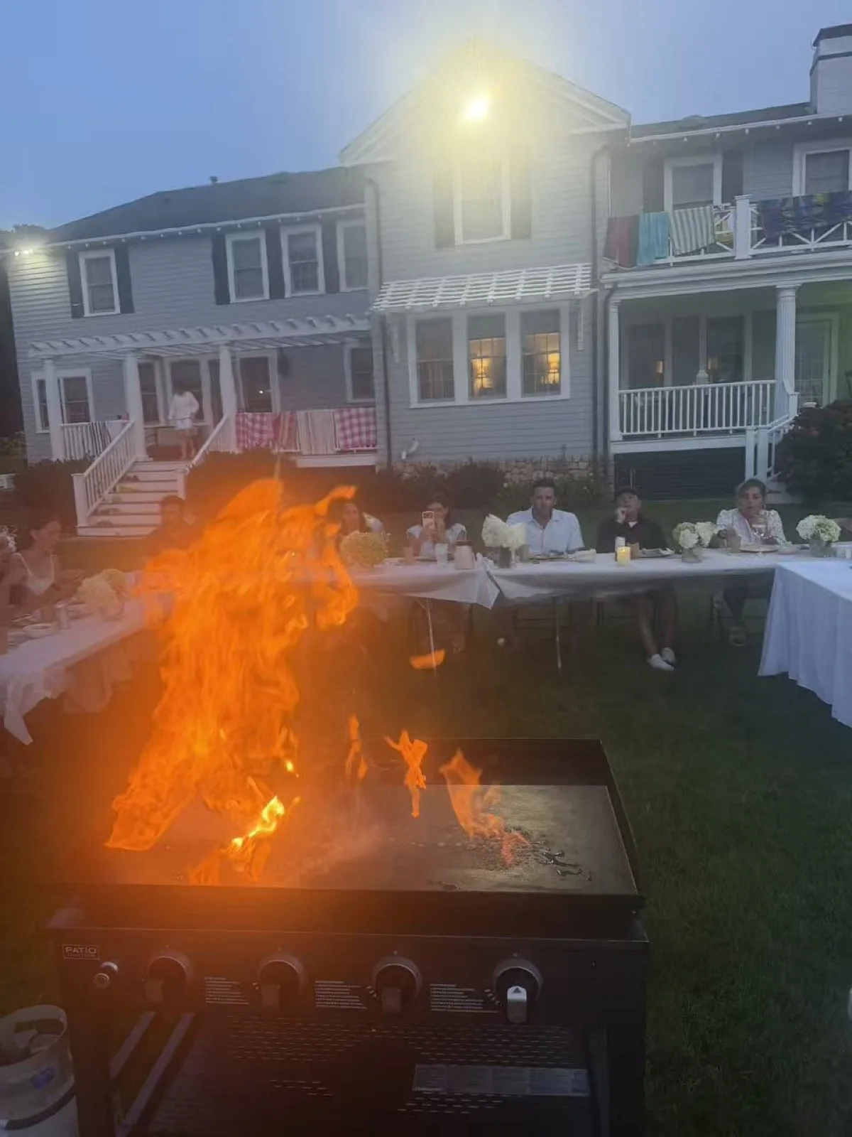 Close-up of flames rising off the teppanyaki griddle during a hibachi fire show in Rhode Island