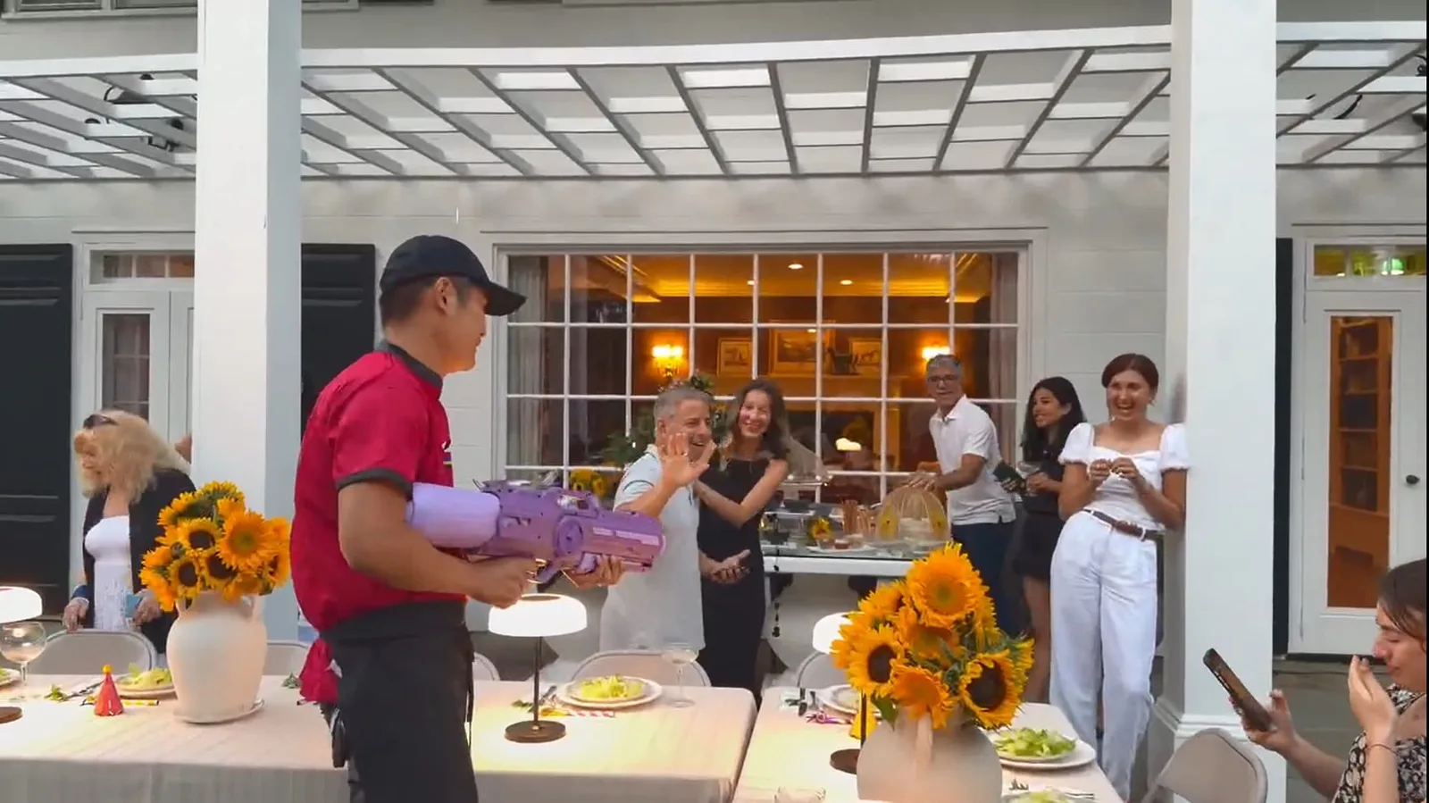 Guests laughing and cheering during a GoFor Hibachi chef performance in Rhode Island